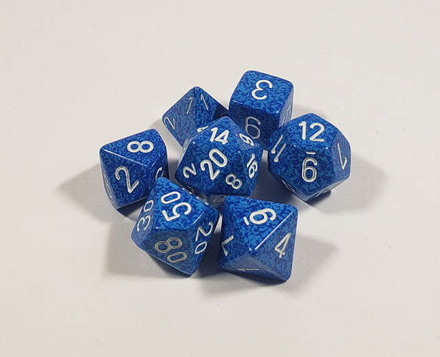 A close up of the Chessex specked Water polyhedral dice set.