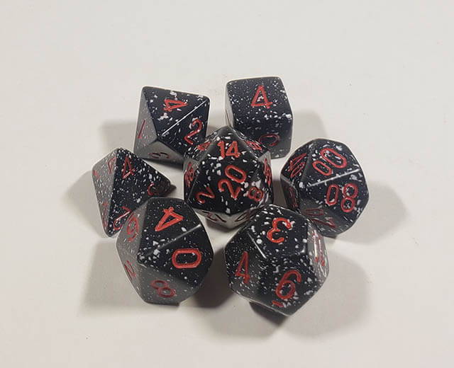 A close up of the Chessex specked  Space polyhedral dice set.