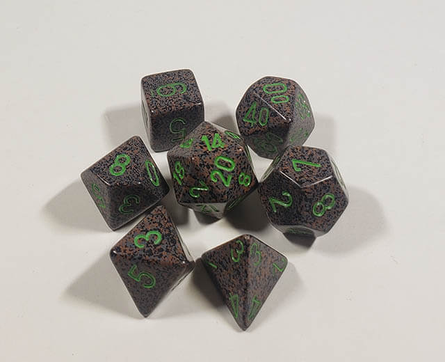 A close up of the Chessex specked Earth polyhedral dice set.
