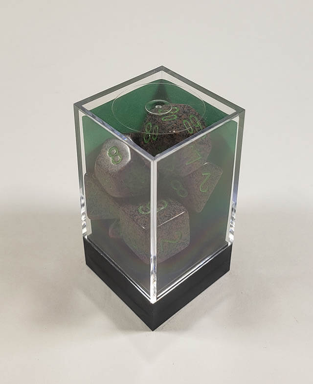 A close up of the Chessex specked Earth polyhedral dice set in its package.