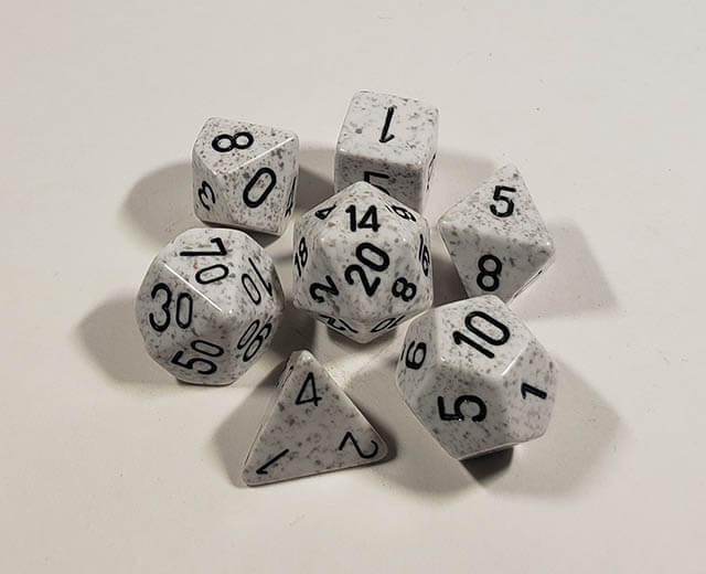 A close up of the Chessex specked Arctic Camo polyhedral dice set.