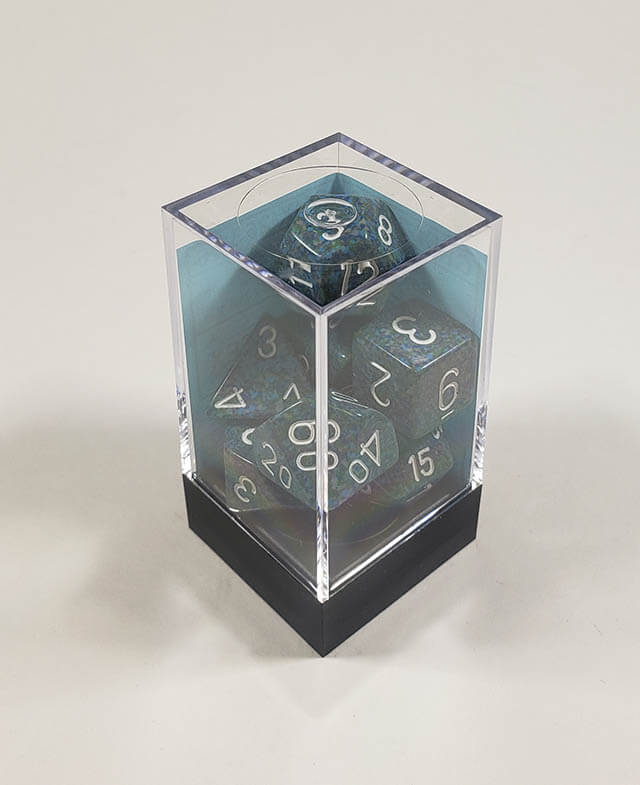 A close up of the Chessex specked Sea polyhedral dice set in its package.