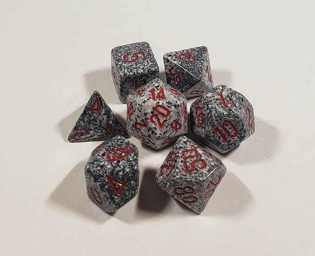A close up of the Chessex specked Granite polyhedral dice set.