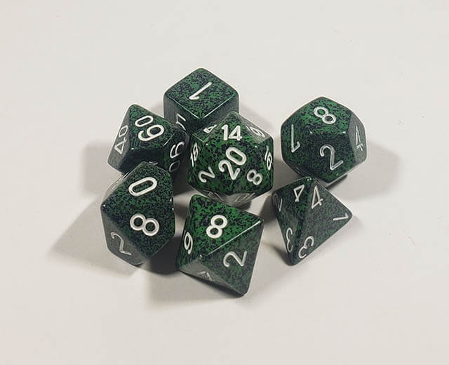A close up of the Chessex specked Recon polyhedral dice set.
