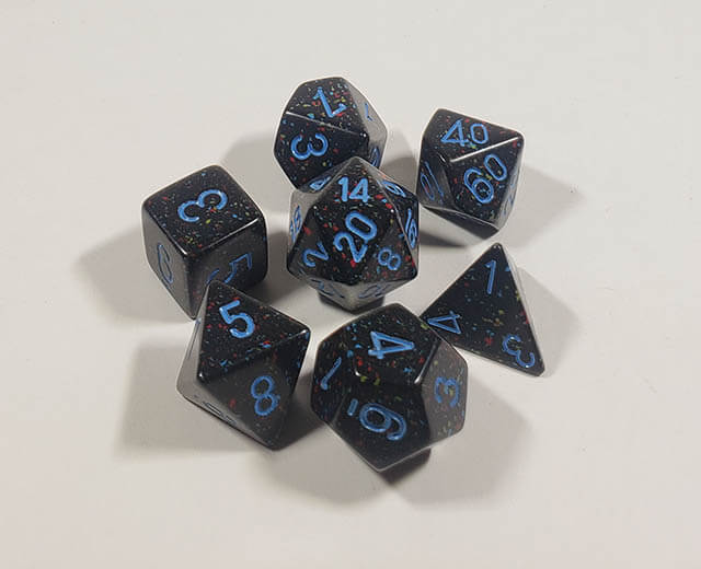 A close up of the Chessex specked Blue Stars polyhedral dice set.