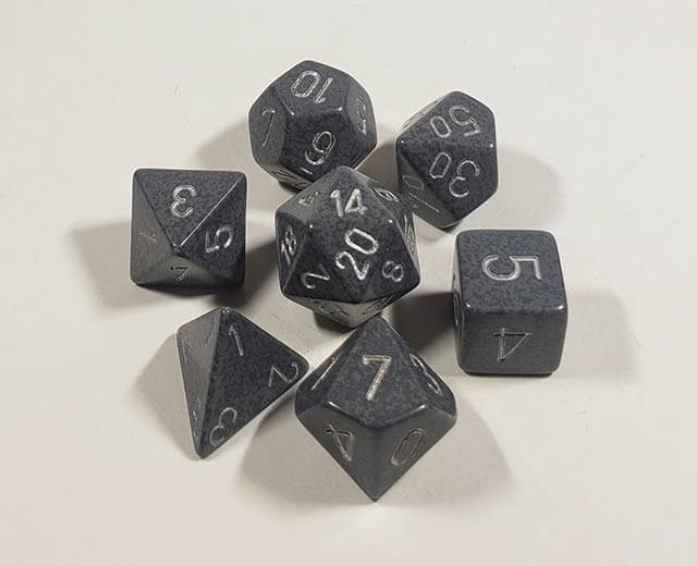 A close up of the Chessex specked Hi-Tech polyhedral dice set.