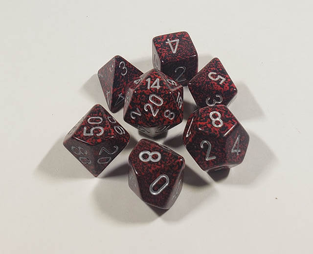 A close up of the Chessex specked Volcano polyhedral dice set.