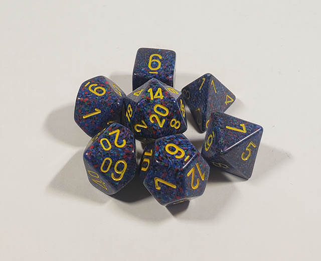 A close up of the Chessex specked Twilight polyhedral dice set.
