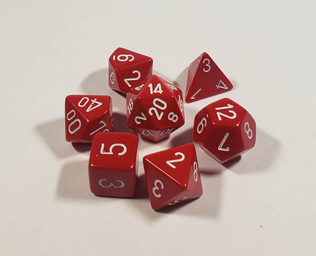 A close up of the Chessex Opaque Red with white polyhedral dice set