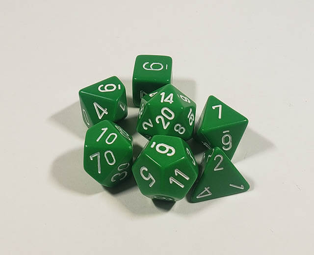 A close up of the Chessex Opaque Green with White polyhedral dice set.