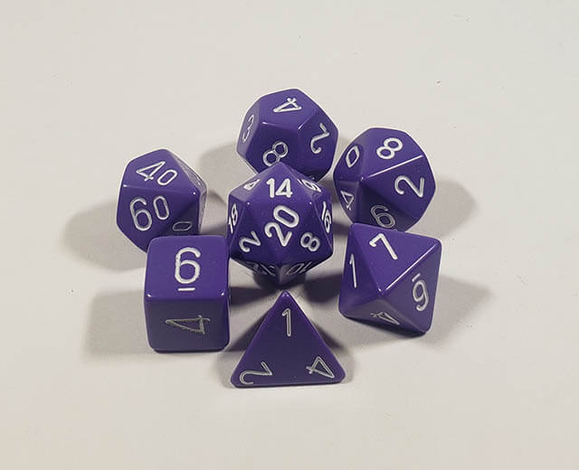 A close up of the Chessex Opaque Purple with White polyhedral dice set.