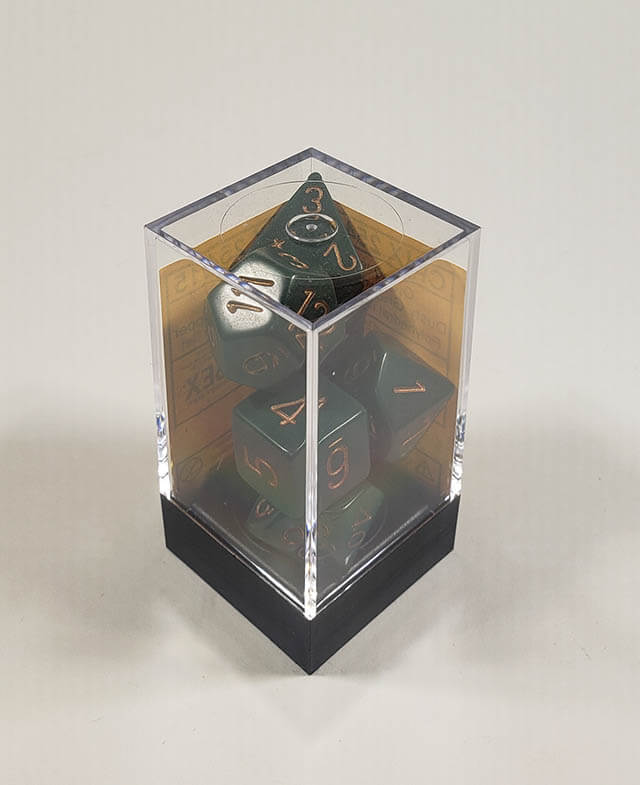 A close up of the Chessex Opaque Green with gold polyhedral dice set in its package.