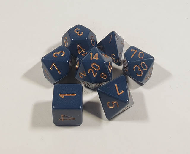 A close up of the Chessex Opaque Dusty Blue with copper polyhedral dice set.