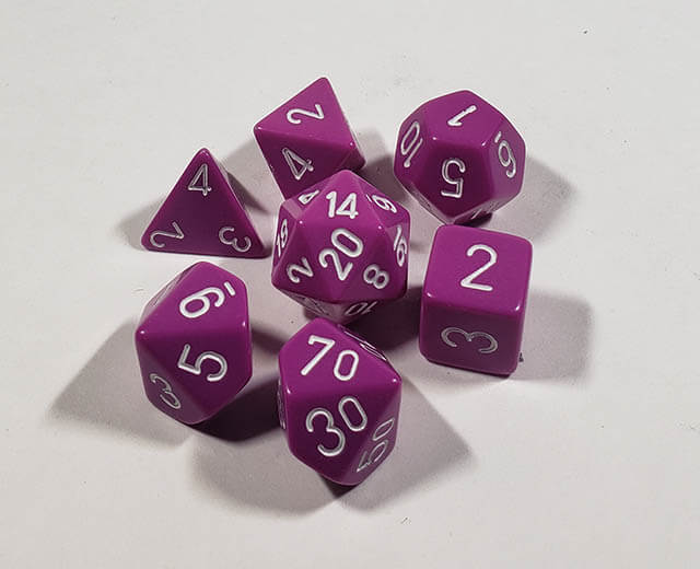 A close up of the Chessex Opaque Light purple with white polyhedral dice set.