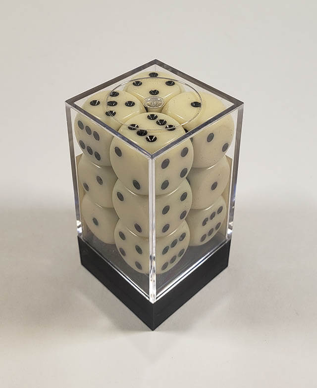 A close up of the Chessex Opaque Ivory with Black 16mm d6 dice set in its package.