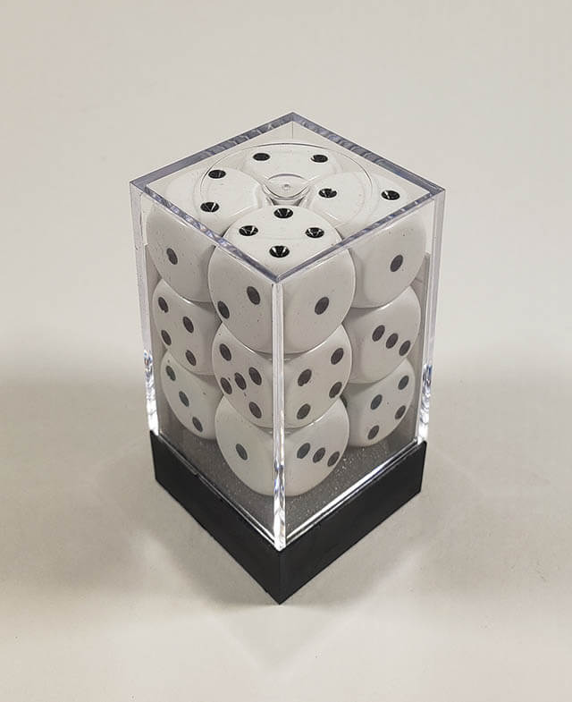 A close up of the Chessex Opaque White with Black 16mm d6 dice set in its package.