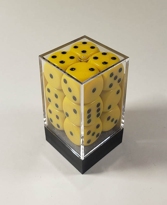 A close up of the Chessex Opaque Yellow with Black 16mm d6 dice set in its package.
