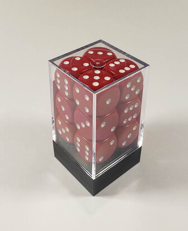 A close up of the Chessex Opaque Red with White 16mm d6 dice set in its package.