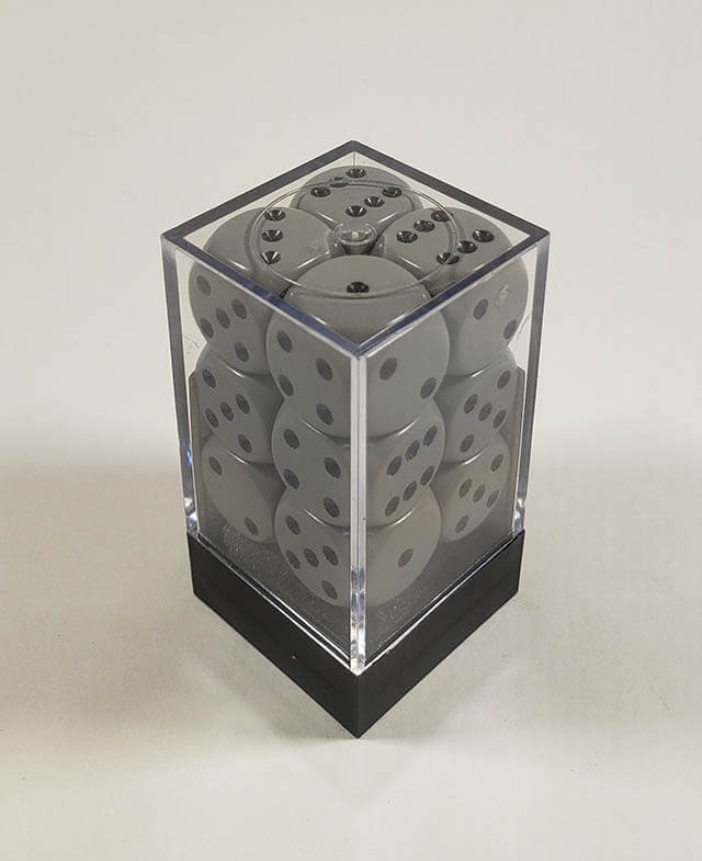A close up of the Chessex Opaque Grey with Black 16mm d6 dice set in its package.