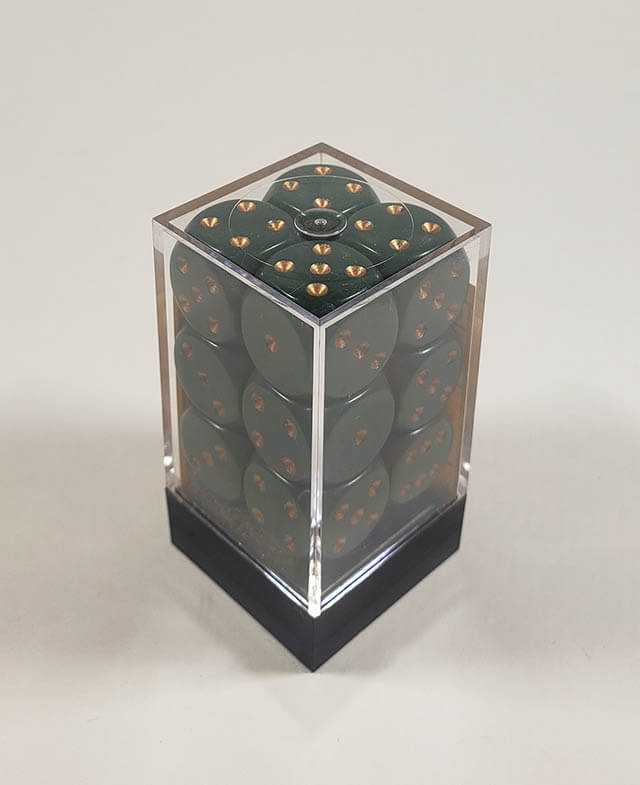 A close up of the Chessex Opaque Dusty Green with Copper 16mm d6 dice set in its package.