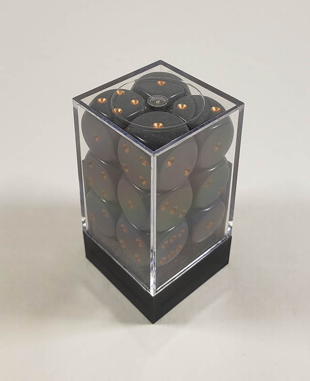 A close up of the Chessex Opaque Dark Grey with Copper 16mm d6 dice set in its package.