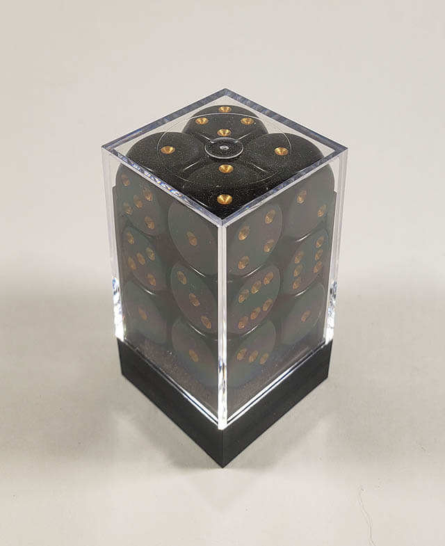 A close up of the Chessex Opaque Black with Gold 16mm d6 dice set in its package.