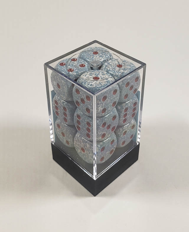 A close up of the Chessex specked air 16mm d6 dice set in its package.