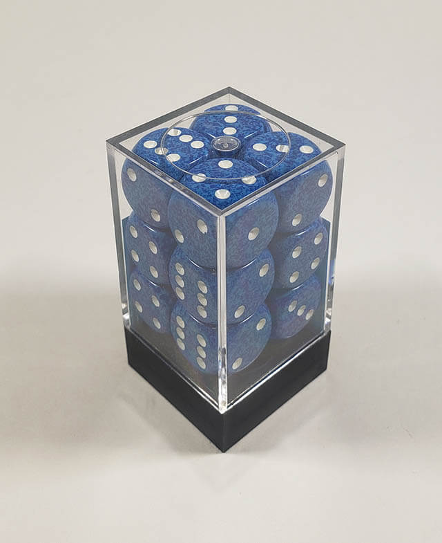 A close up of the Chessex specked water 16mm d6 dice set in its package.