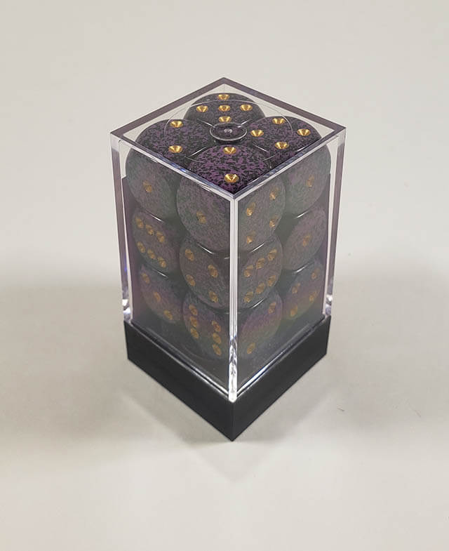 A close up of the Chessex specked hurricane 16mm d6 dice set in its package.