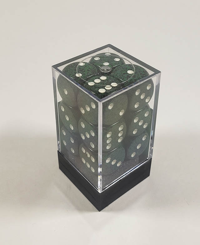 A close up of the Chessex specked recon 16mm d6 dice set in its package.