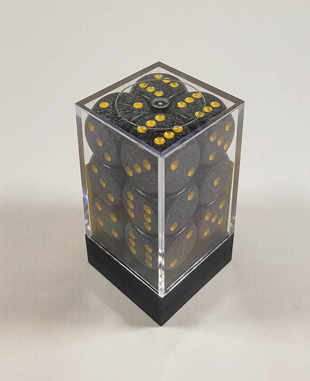 A close up of the Chessex specked urban camo 16mm d6 dice set in its package.