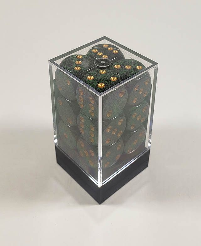 A close up of the Chessex specked golden recon 16mm d6 dice set in its package.