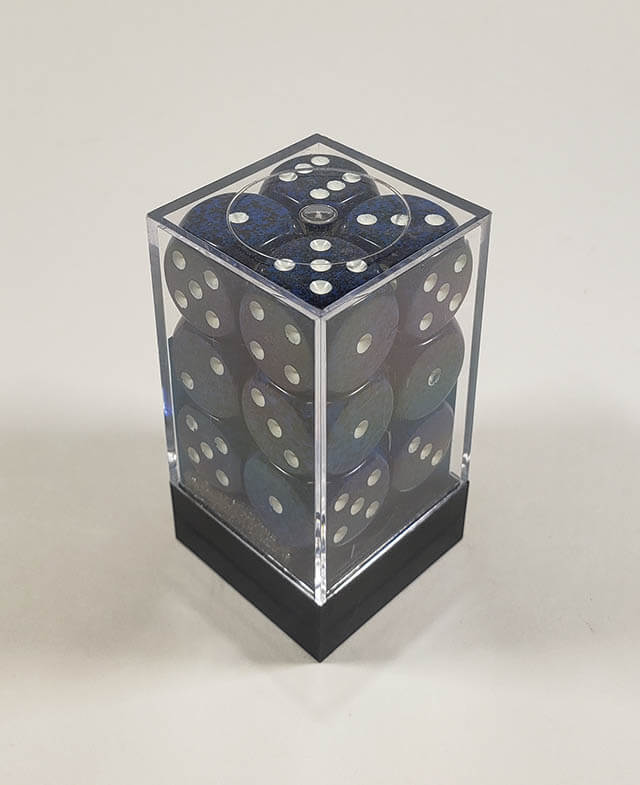 A close up of the Chessex specked Stealth 16mm d6 dice set in its package.