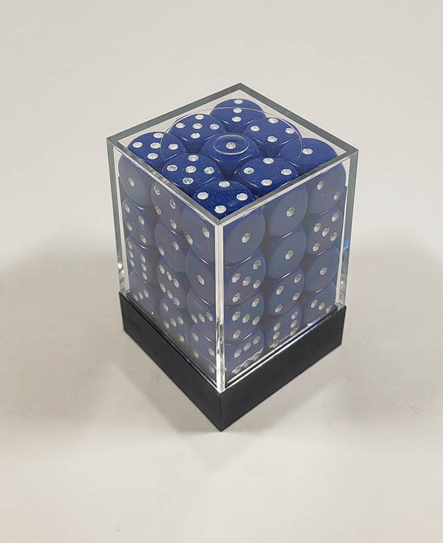A close up of the Chessex Opaque Blue with White 12mm d6 dice set in its package.