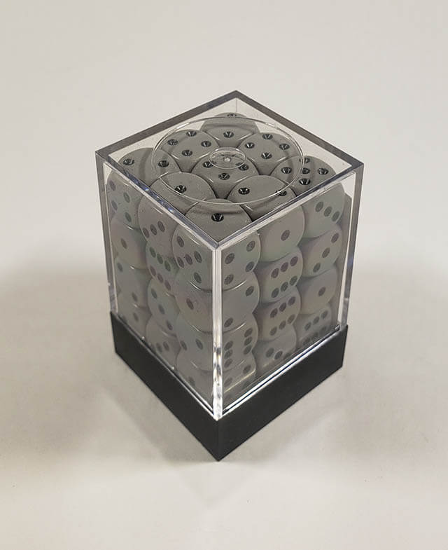 A close up of the Chessex Opaque Grey with Black 12mm d6 dice set in its package.