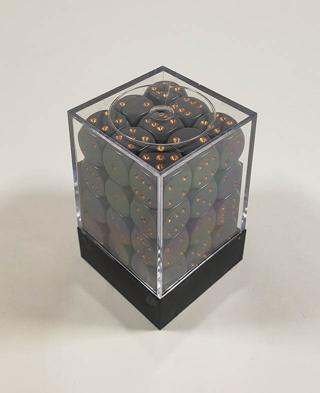 A close up of the Chessex Opaque Dark Grey with Copper 12mm d6 dice set in its package.