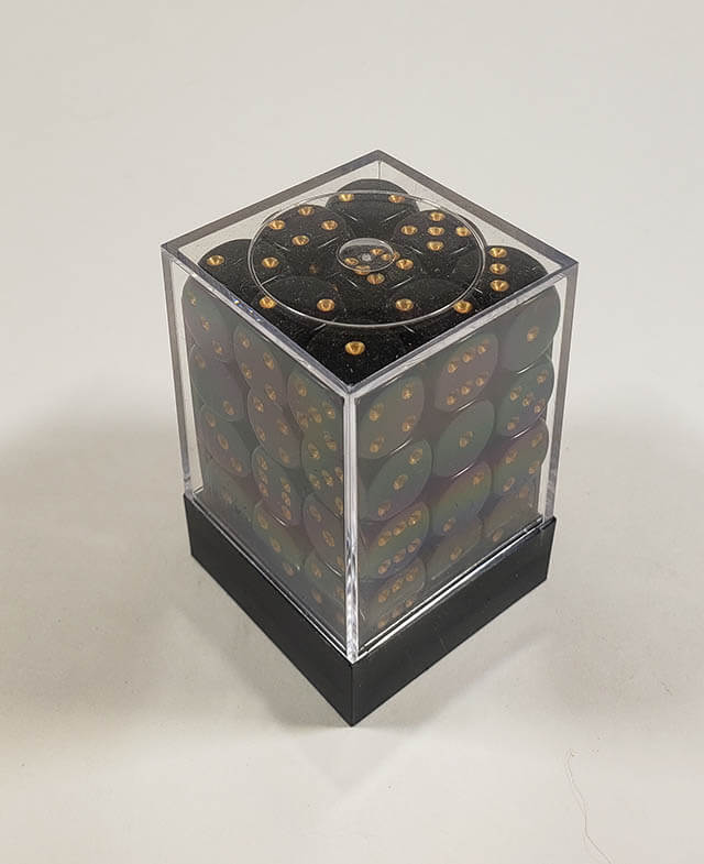 A close up of the Chessex Opaque Black with Gold 12mm d6 dice set in its package.