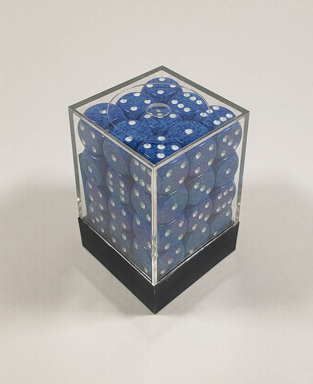 A close up of the Chessex specked water 12mm d6 dice set in its package.