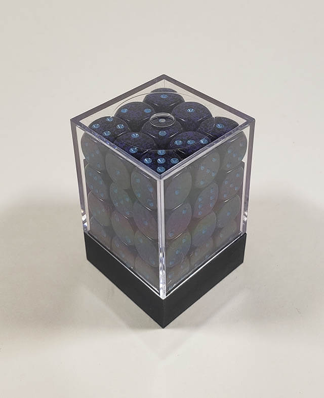 A close up of the Chessex specked cobalt 12mm d6 dice set in its package.
