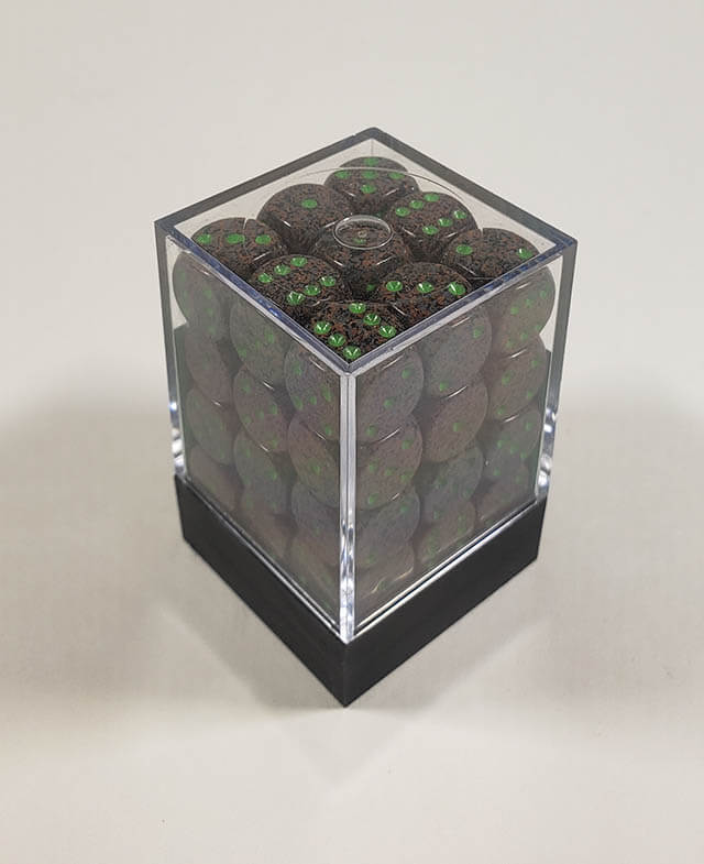 A close up of the Chessex specked earth 12mm d6 dice set in its package.