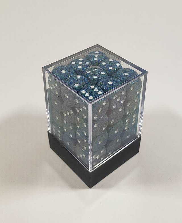 A close up of the Chessex specked sea 12mm d6 dice set in its package.