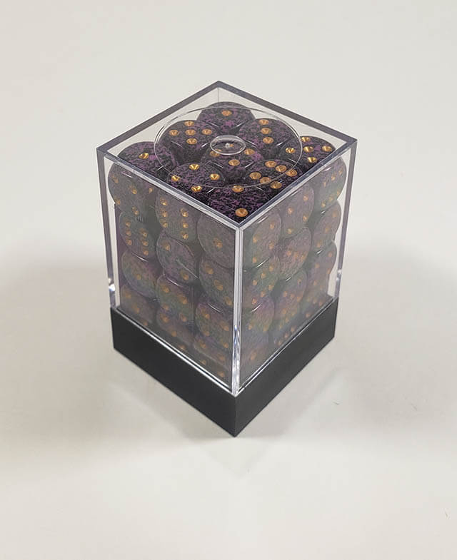 A close up of the Chessex specked water 12mm d6 dice set in its package.