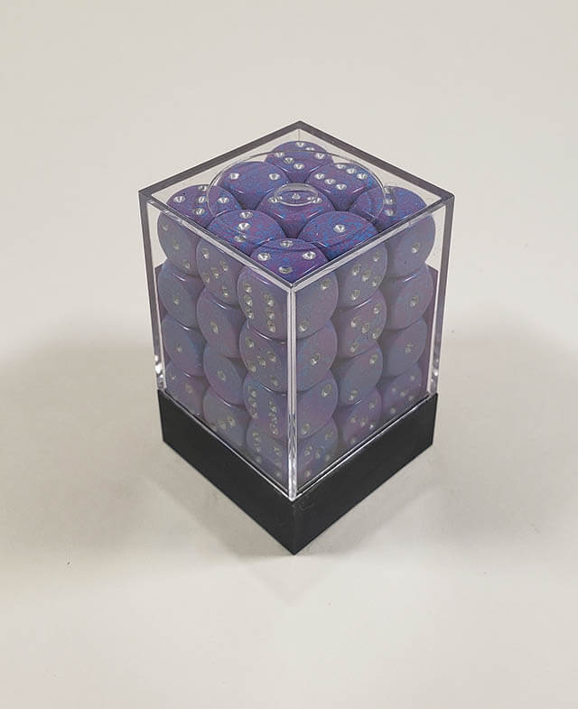 A close up of the Chessex specked silver tetra 12mm d6 dice set in its package.