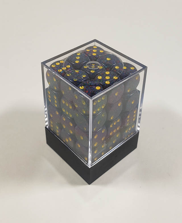 A close up of the Chessex specked twilight 12mm d6 dice set in its package.
