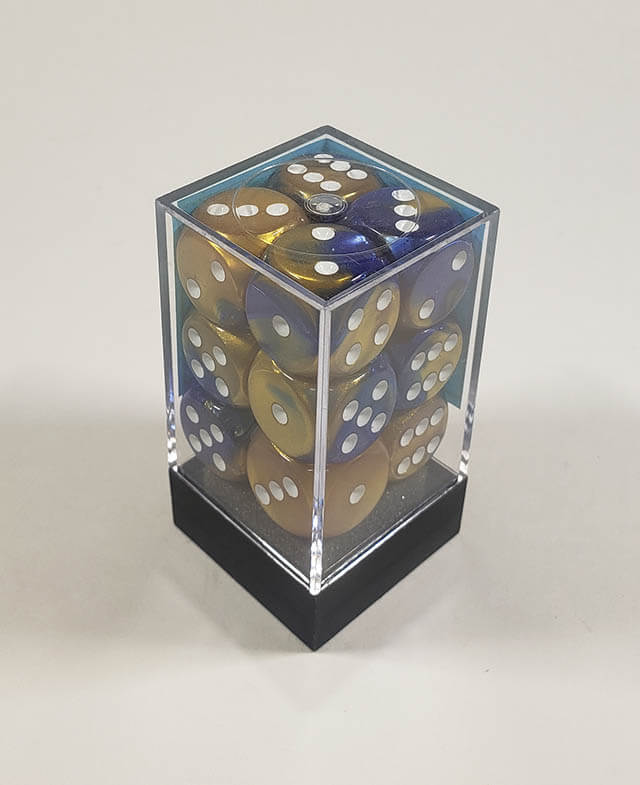 A close up of the Chessex Gemini Blue and Gold 16mm d6 dice set in its package.