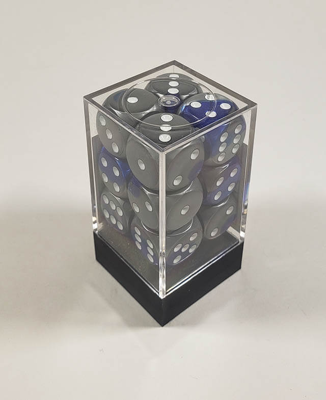 A close up of the Chessex Gemini Blue and Steel 16mm d6 dice set in its package.