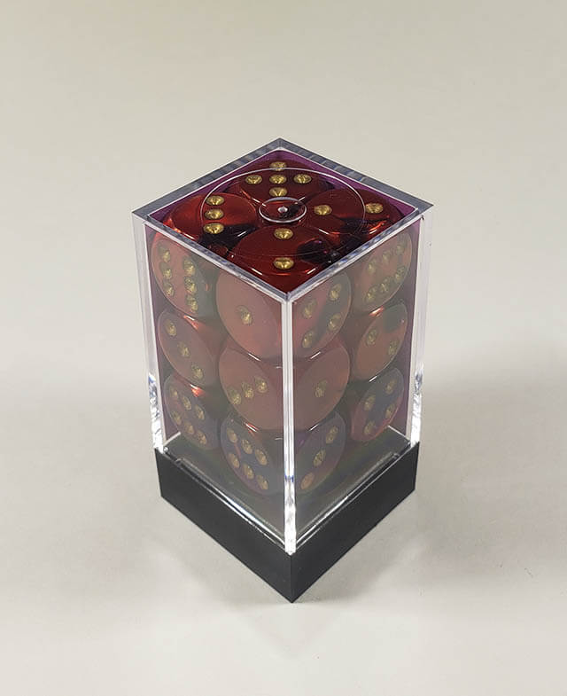 A close up of the Chessex Gemini Purple and Red 16mm d6 dice set in its package.