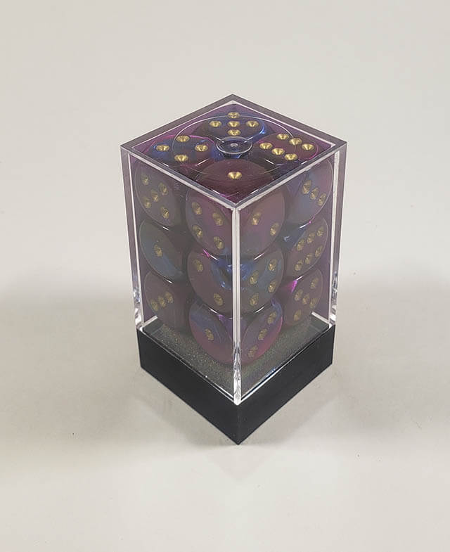 A close up of the Chessex Gemini Blue and Purple 16mm d6 dice set in its package.