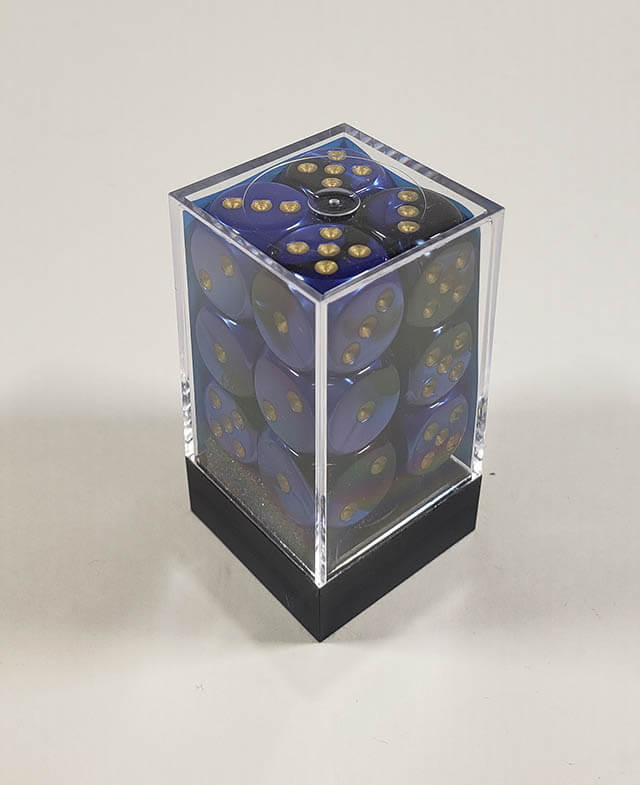 A close up of the Chessex Gemini Black Blue 16mm d6 dice set in its package.