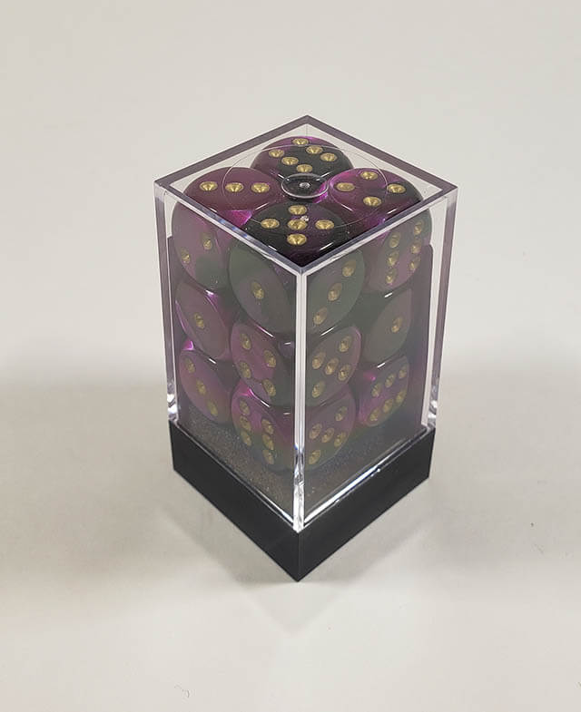 A close up of the Chessex Gemini Black and Purple 16mm d6 dice set in its package.